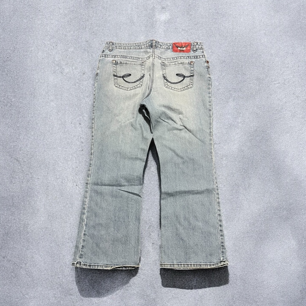 Low rise flare jeans with a cute floral design on the back pockets #fairycore